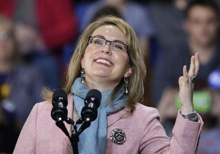 FILE - In this Nov. 7, 2016 file photo, former Arizona Rep. Gabby Giffords speaks at a campaign event for Democratic presidential candidate Hillary Clinton at the University of New Hampshire in Durham, N.H. Giffords is highlighting the launch of a group supporting a Democratic congressional candidate in Ohio. Giffords and some 200 women are expected to gather Wednesday, June 13, 2018, for “Women for Aftab,” backing Aftab Pureval’s 1st House District challenge to veteran Republican Rep. Steve Chabot. (AP Photo/Elise Amendola, File)