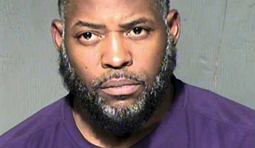 FILE - This undated file photo provided by the Maricopa County Sheriff&#39;s Department shows Abdul Malik Abdul Kareem. Kareem, convicted of helping to plot a 2015 attack on a Prophet Muhammad cartoon contest in suburban Dallas, is seeking a new trial. His lawyers argue prosecutors didn&#39;t reveal at trial that an undercover FBI agent who witnessed the shooting in Garland had communicated about the contest with an accused recruiter for the Islamic State. (Maricopa County Sheriff&#39;s Department via AP, File)