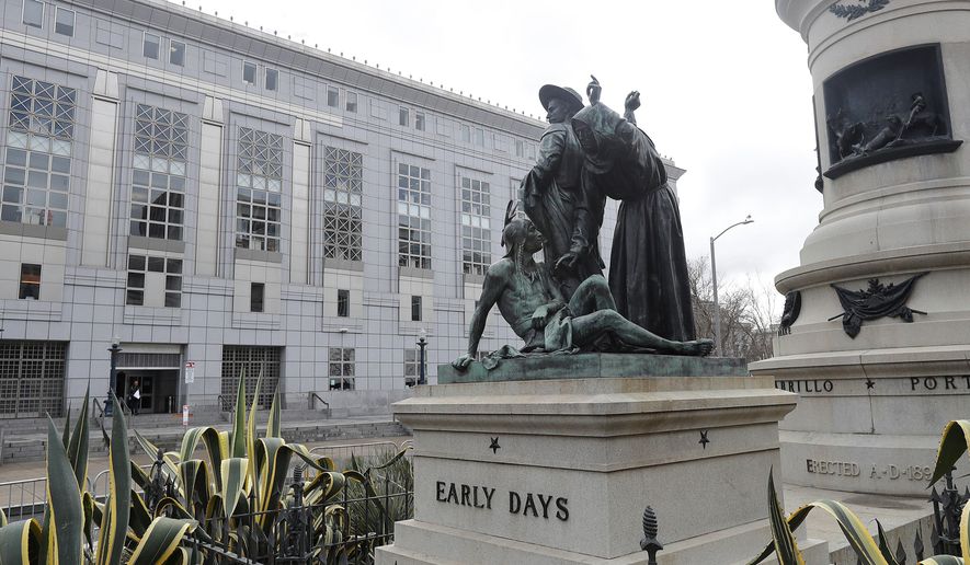 FILE - This March 2, 2018 file photo shows a statue that depicts a Native American at the feet of a Spanish cowboy and Catholic missionary in San Francisco. San Francisco authorities have renewed debate over removing the prominent 19th century statue. The San Francisco Board of Appeals on Wednesday, June 13, 2018, will decide whether to reconsider its decision to keep the statue named "Early Days" in place near City Hall. (AP Photo/Jeff Chiu, File)