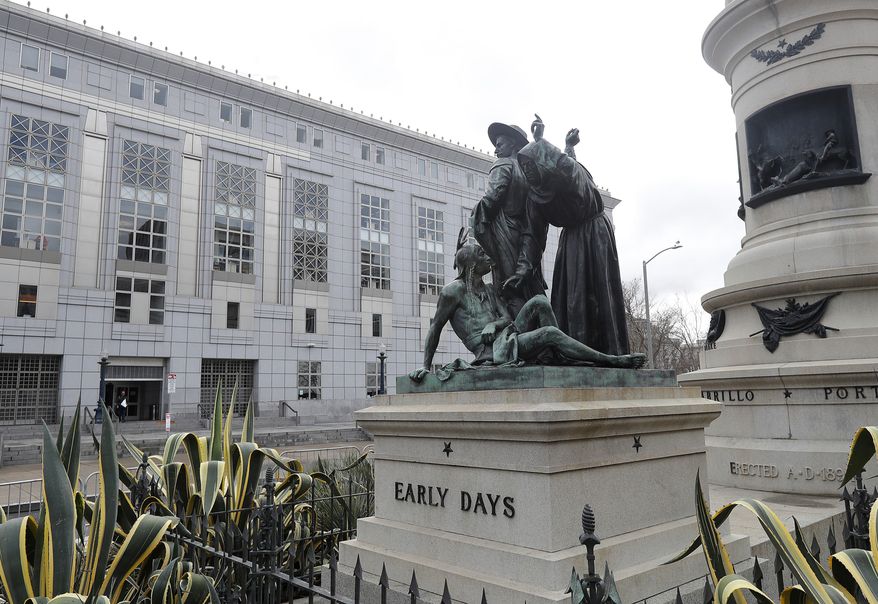 FILE - This March 2, 2018 file photo shows a statue that depicts a Native American at the feet of a Spanish cowboy and Catholic missionary in San Francisco. San Francisco authorities have renewed debate over removing the prominent 19th century statue. The San Francisco Board of Appeals on Wednesday, June 13, 2018, will decide whether to reconsider its decision to keep the statue named "Early Days" in place near City Hall. (AP Photo/Jeff Chiu, File)