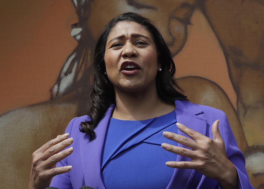 FILE - In this June 6, 2018 file photo, mayoral candidate and Board of Supervisors President London Breed speaks to reporters in San Francisco. Breed was poised to become the first African-American woman to lead San Francisco following a hard-fought campaign when a former state senator conceded and congratulated her Wednesday,  June 13, more than a week after the election. (AP Photo/Jeff Chiu, File)
