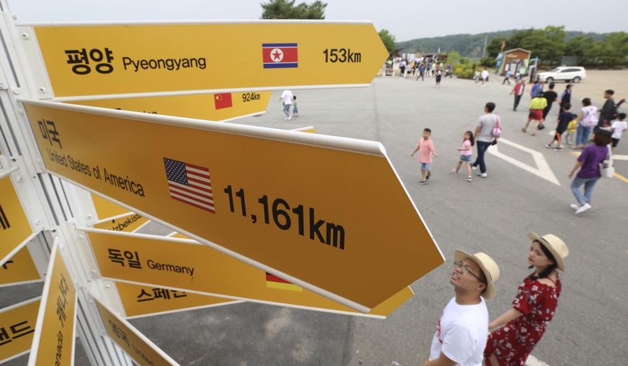 Destination signs to North Korea's capital Pyongyang, top, and the United States, center, are seen at the Imjingak Pavilion in Paju near the border village of Panmunjom, South Korea, Wednesday, June 13, 2018. While South Koreans cheered with hope and China saw an opening to discuss lifting sanctions on North Korea, some countries in Europe and the Mideast cautioned Tuesday that it was premature to judge U.S. President Donald Trump and North Korean leader Kim Jong Un's summit a success. (AP Photo/Ahn Young-joon)
