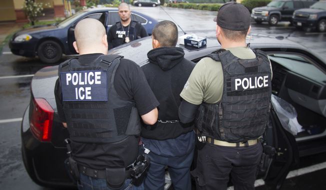 In this Feb. 7, 2017, file photo released by U.S. Immigration and Customs Enforcement, foreign nationals are arrested during a targeted enforcement operation conducted by U.S. Immigration and Customs Enforcement (ICE) aimed at immigration fugitives, re-entrants and at-large criminal aliens in Los Angeles. (Charles Reed/U.S. Immigration and Customs Enforcement via AP, File)