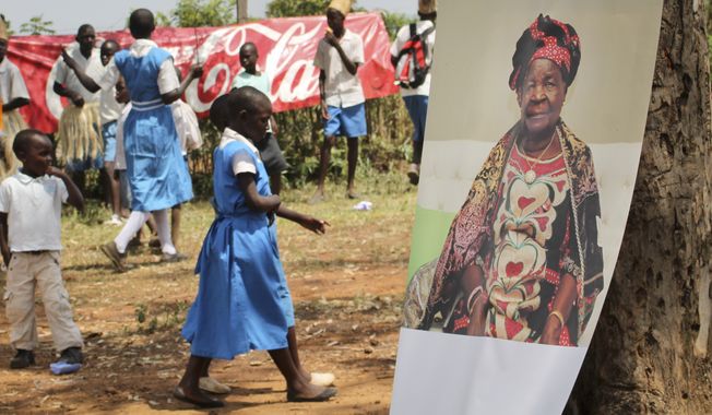 A poster of Sarah Obama, the step-grandmother of President Barack Obama, is displayed during a groundbreaking ceremony for her Mama Sarah Obama Foundation charitable organization, in her home town of Kogelo, near Kisumu, in Kenya Saturday, July 18, 2015. President Barack Obama is due to make his first trip as president to Kenya later in the month, the country of his father&#x27;s birth, to attend the Global Entrepreneurship Summit, which brings together business leaders, international organizations and governments. (AP Photo)