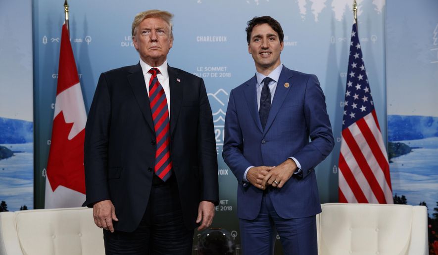In this June 8, 2018, file photo, U.S. President Donald Trump meets with Canadian Prime Minister Justin Trudeau at the G-7 summit in Charlevoix, Canada. (AP Photo/Evan Vucci, File)