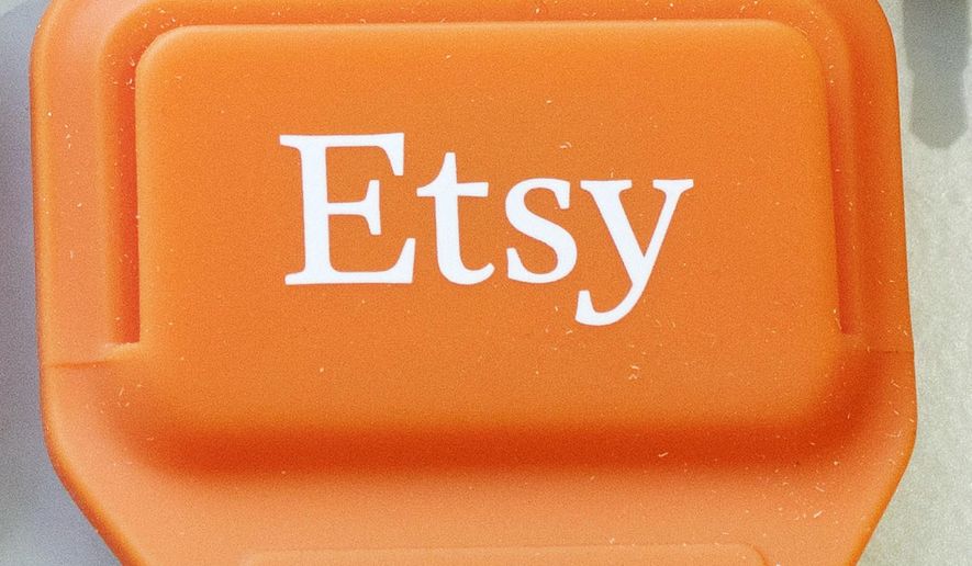 FILE - This Jan. 6, 2015 file photo shows an Etsy mobile credit card reader, in New York. Etsy’s stock soared in early trading on Thursday, June 14, 2018, as the online crafts marketplace announced that it’s increasing its transaction fee and boosted its full-year revenue outlook. (AP Photo/Mark Lennihan, File)