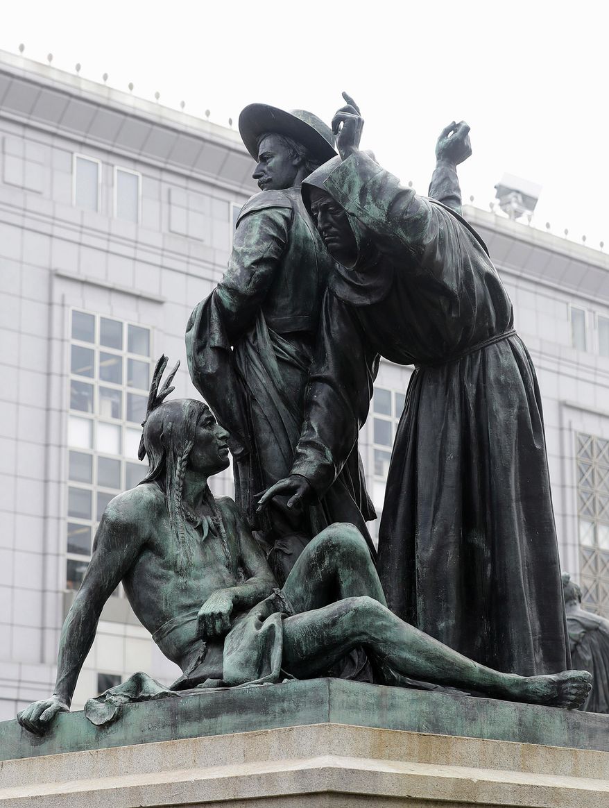 FILE - This March 2, 2018 file photo shows a statue that depicts a Native American at the feet of a Spanish cowboy and Catholic missionary in San Francisco. Activists urging the removal of the prominent 19th century statue will get another chance to make their case. The San Francisco Chronicle reports the city's Board of Appeals voted Wednesday, June 13 to grant a rehearing on removing the "Early Days" statue near City Hall. (AP Photo/Jeff Chiu, File)