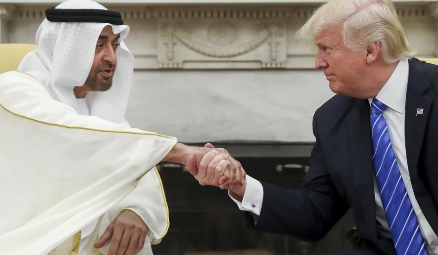 In this May 15, 2017, file photo, U.S. President Donald Trump, right, shakes hands with Abu Dhabi&#39;s crown prince, Sheikh Mohammed bin Zayed Al Nahyan, in the White House in Washington. Yemen&#39;s yearslong war between Shiite rebels and a Saudi-led coalition backing its exiled government has escalated with an assault on the insurgent-held port city of Hodeida. (AP Photo/Andrew Harnik) **FILE**