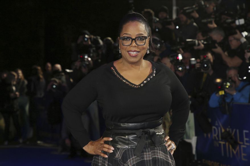 In this March 13, 2018, file photo, actress Oprah Winfrey poses for photographers upon arrival at the premiere of the film &quot;A Wrinkle In Time&quot; in London. (Photo by Joel C Ryan/Invision/AP, File)