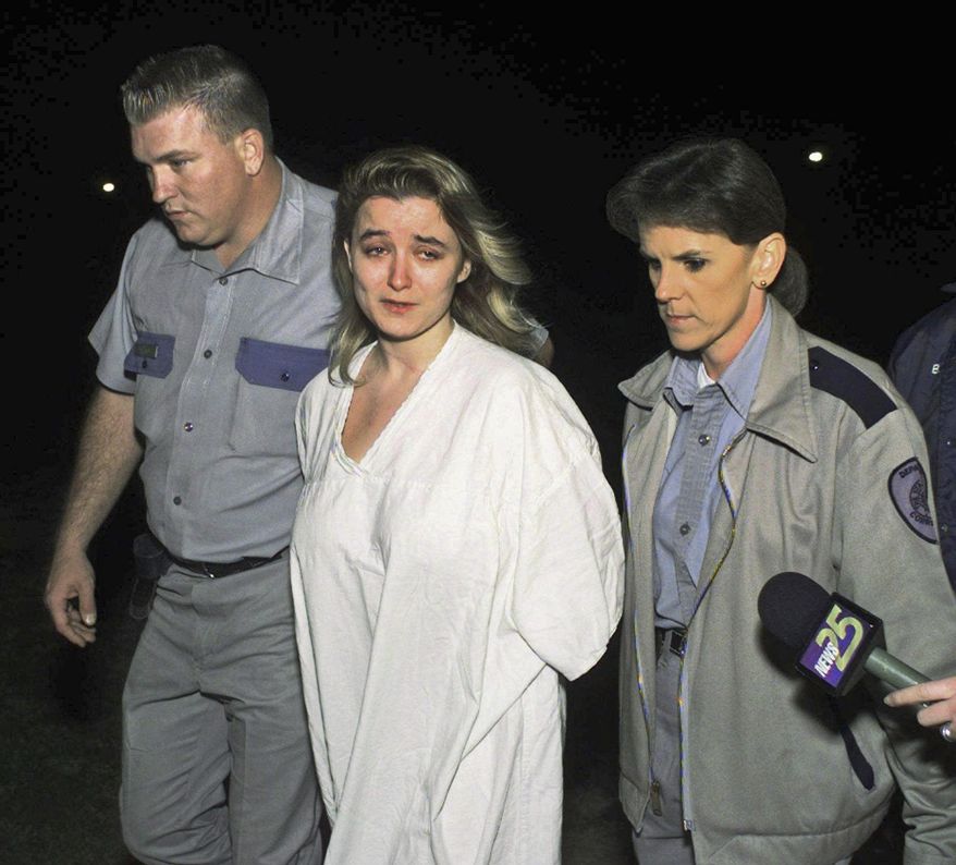 FILE – In this Feb. 5, 1997, file photo, Darlie Routier, sentenced to death for the fatal stabbing of her 5-year-old son Damon, is escorted by Chris Cassell, left, and Maryanne Cox, right, into the Texas Department of Criminal Justice's Mountain View Unit, a women's prison in Gatesville, Texas. Television network ABC's seven-week documentary series that premiered Tuesday, June 12, 2018, titled "The Last Defense," examines the American justice system through the convictions of Routier, who is a native of Altoona, Pa., and Oklahoma death row inmate Julius Jones, found guilty of first-degree murder after a fatal shooting and carjacking in July 1999. (AP Photo/Ron Heflin, File)