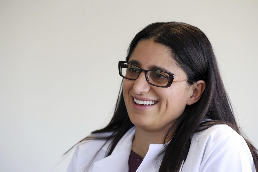In this Thursday, May 17, 2018 photo, Dr. Mona Hanna-Attisha is interviewed in Flint, Mich. A new book about Flint’s water crisis comes from the pediatrician and public health expert who was first to reveal the extent of lead contamination on the struggling city’s children. Dr. Hanna-Attisha’s book, “What The Eyes Don’t See: A Story of Crisis, Resistance, and Hope in an American City,” goes on sale Tuesday, June 19. (AP Photo/Carlos Osorio)