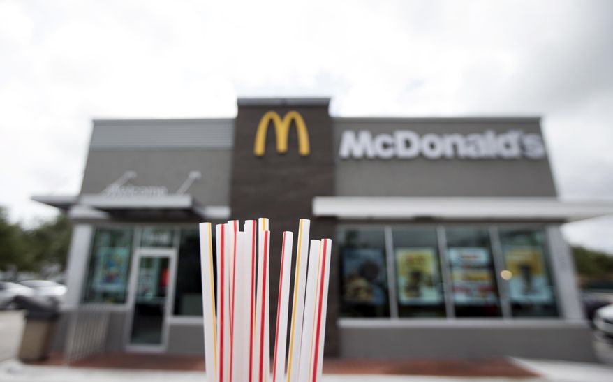 FILE - In this May 24, 2018, file photo, plastic straws from a McDonald's restaurant are shown in Doral, Fla. McDonald’s said Friday, June 15, 2018 it will switch to paper straws at all its locations in the United Kingdom and Ireland, and test an alternative to plastic ones in some of its U.S. restaurants later this year. (AP Photo/Wilfredo Lee, File)