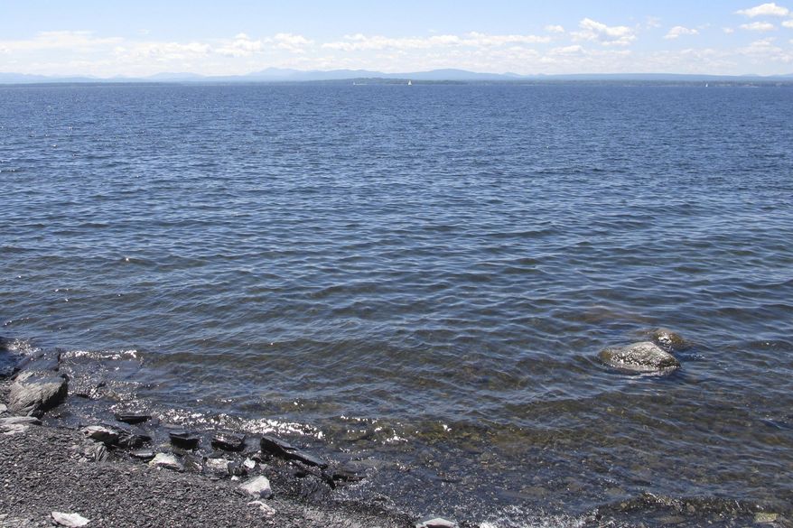This Friday, June, 15, 2018 photo shows Lake Champlain from the ferry landing in Grand Isle, Vt. Burlington, Vermont, officials said a computer malfunction is to blame for the release of some 3 million gallons of partially-treated wastewater into the lake early on the morning of July 12, 2018. (AP Photo/Lisa Rathke) **FILE**