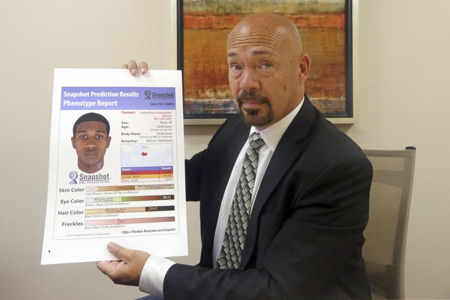 Private investigator Jason Jensen holds a phenotype report at his office Friday, June 15, 2018, in Salt Lake City. Groups of private investigators in Utah and California have been emboldened by the arrest of the suspected Golden State Killer and are spearheading a push to replicate authorities' use of DNA evidence in that case by urging amateur genealogists to contribute genetic information to a public DNA database, despite concerns about privacy. (AP Photo/Rick Bowmer)