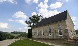 This Friday, June 1, 2018 photo shows the former Lattnerville Church in Graf, Iowa, which has been converted into an inn. (Nicki Kohl/Telegraph Herald via AP)
