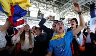 Supporters of Ivan Duque, candidate of the Democratic Centre party, celebrate the presidential election results in Bogota, Colombia, on Sunday. (Associated Press Photographs)