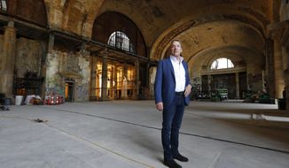 In this Thursday, June 14, 2018 photo, Bill Ford Jr., Ford Motor Company Executive Chairman and Chairman of the Board, poses in the Michigan Central Station in Detroit. Ford Motor Co. is embarking on a 4-year renovation of the 105-year-old depot and 17-story office tower just west of downtown. The massive project is expected to increase the automaker’s footprint in the city where the company was founded, provide space for electric and autonomous vehicle testing and research and spur investment in the surrounding neighborhood. (AP Photo/Paul Sancya)