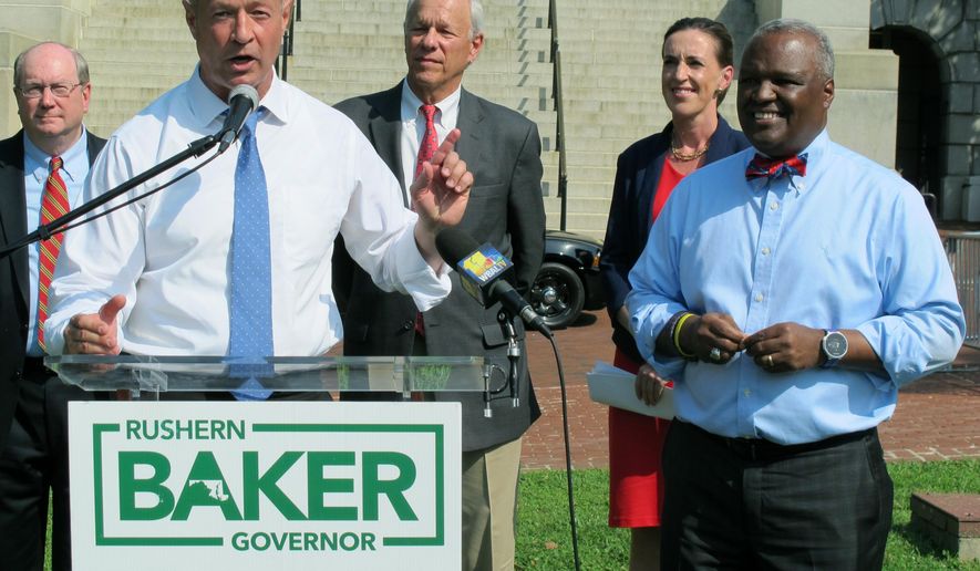 FILE - In this June 7, 2018 file photo, former Gov. Martin O'Malley, front left, endorses Prince George's County Executive Rushern Baker, right, for governor of Maryland, in Annapolis, Md. With two leading candidates who have a shot at becoming Maryland’s first black governor, the crowded Democratic gubernatorial primary reflects the state’s changing demographics and the party’s efforts to harness the energy of an increasingly diverse electorate around the country. Recent polls show former NAACP President Ben Jealous and Baker are leading in a close and crowded primary. (AP Photo/Brian Witte, File)