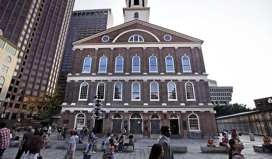 FILE - In this Monday, Aug. 21, 2017, file photo, pedestrians pass Faneuil Hall, also known as &amp;quot;the Cradle of Liberty&amp;quot; in Boston. Faneuil Hall, of the most iconic buildings in Boston, where the earliest calls for independence from Britain were sounded in the late 1700s, is named for a man who owned and traded black slaves. Now a move to rename the historic structure is gaining momentum. (AP Photo/Charles Krupa, File)