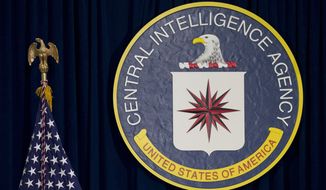 This April 13, 2016, file photo shows the seal of the Central Intelligence Agency at CIA headquarters in Langley, Va. (AP Photo/Carolyn Kaster, File)