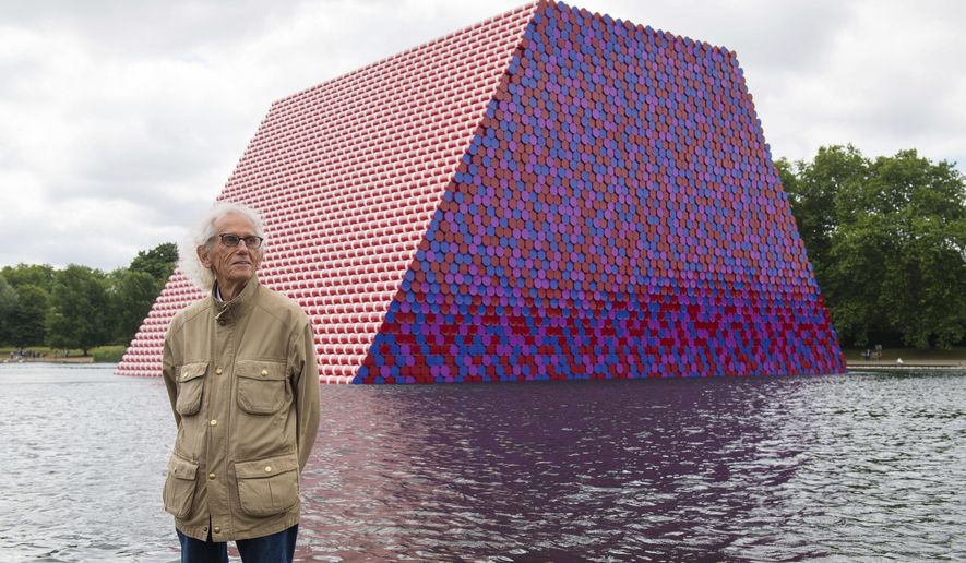 Artist Christo attends the unveiling of his first UK outdoor exhibit, The London Mastaba, on the Serpentine Lake in Hyde Park, central London, Monday June 18, 2018. The sculpture consists of 7,506 horizontally stacked barrels on a floating platform in the lake. (Dominic Lipinski/PA via AP)