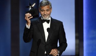 FILE - In this June 7, 2018 file photo, actor/director George Clooney accepts the 46th AFI Life Achievement Award during a gala ceremony in Los Angeles. The ceremony will air on Thursday, June 21. (Photo by Chris Pizzello/Invision/AP, File)