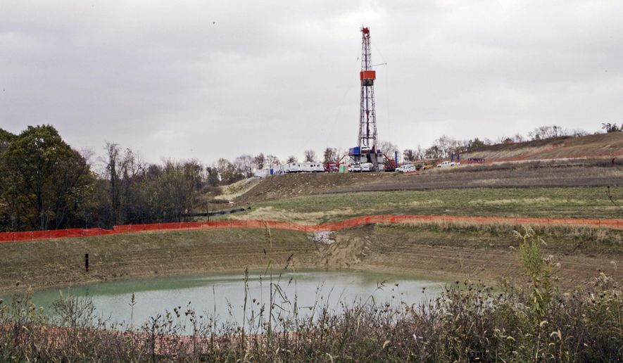 FILE – In this Oct. 29, 2008, file photo, a drilling rig used to extract natural gas from the Marcellus Shale, located on a hill above a pond on John Dunn's farm in the Washington County borough of Houston, Pa. New research suggests drinking water supplies in Pennsylvania have shown resilience in the face of a drilling boom that has turned swaths of countryside into a major production zone for natural gas. (AP Photo/Keith Srakocic, File)