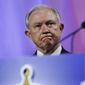 U.S. Attorney General Jeff Sessions listens as he is introduced to speak at the National Sheriffs&#39; Association convention in New Orleans, Monday, June 18, 2018. (AP Photo/Gerald Herbert)