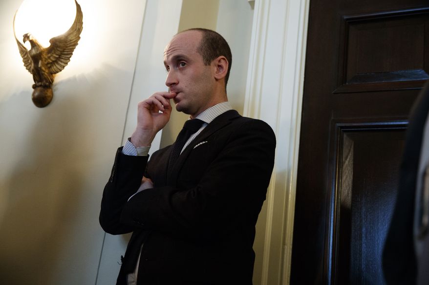 Senior White House adviser Stephen Miller listens as President Donald Trump speaks during a meeting with lawmakers on immigration policy in the Cabinet Room of the White House, Tuesday, Jan. 9, 2018, in Washington. (AP Photo/Evan Vucci)