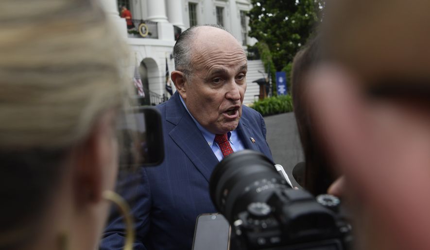 President Donald Trump&#39;s lawyer Rudy Giuliani speaks to reporter&#39;s following the White House Sports and Fitness Day event on the South Lawn of the White House in Washington, Wednesday, May 30, 2018. (AP Photo/Susan Walsh)