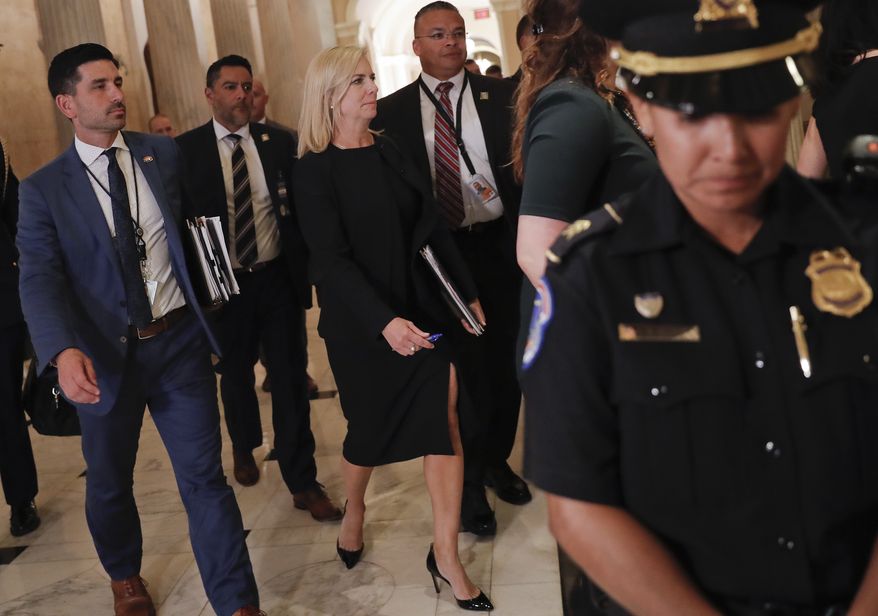 Homeland Security Secretary Kirstjen Nielsen, center, walks at the U.S. Capitol in Washington, after attending a meeting with President Donald Trump and members of the GOP leadership, Tuesday, June 19, 2018. (AP Photo/Pablo Martinez Monsivais)