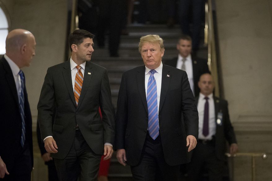 President Donald Trump, accompanied by House Speaker Paul Ryan of Wis., arrives on Capitol Hill in Washington, Tuesday, June 19, 2018, to rally Republicans around a GOP immigration bill. (AP Photo/Andrew Harnik) ** FILE **