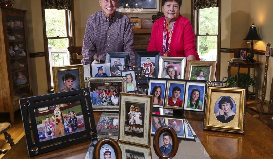 FILE - This Sept. 24, 2014 file photo shows Carl and Mary Brown, founders of the South Carolina Foster Parent Association, who were recently given the congressional Angels in Adoption honor, recognizing people who have made extraordinary contributions on behalf of children in need of families. The Browns have been married 58 years and fostered more than 200 children, adopted six in addition to raising their three biological children. Carl said he supported the new South Carolina Birth Certificate Act and said many of his foster children at some point in their life wanted to know from where they came and who they are. The new South Carolina law will allow children adopted in the state to see their sealed birth certificates after they turn 18 with written consent from their birth parents. (Tim Dominick/The State via AP)