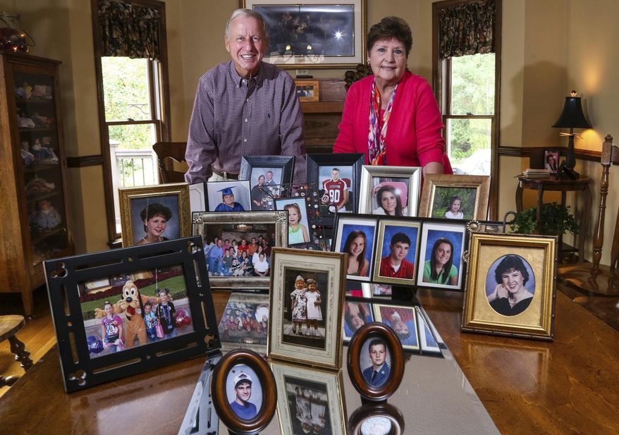 FILE - This Sept. 24, 2014 file photo shows Carl and Mary Brown, founders of the South Carolina Foster Parent Association, who were recently given the congressional Angels in Adoption honor, recognizing people who have made extraordinary contributions on behalf of children in need of families. The Browns have been married 58 years and fostered more than 200 children, adopted six in addition to raising their three biological children. Carl said he supported the new South Carolina Birth Certificate Act and said many of his foster children at some point in their life wanted to know from where they came and who they are. The new South Carolina law will allow children adopted in the state to see their sealed birth certificates after they turn 18 with written consent from their birth parents. (Tim Dominick/The State via AP)