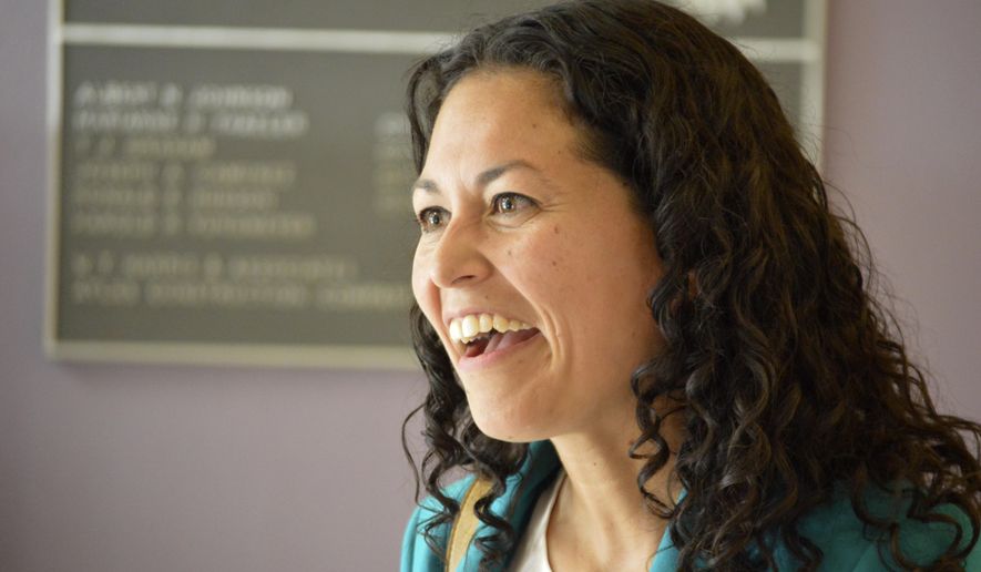 In this May 24, 2018 photo Xochitl Torres Small, a Democratic candidate for Congress, speaks to voters at a Las Cruces, N.M., event. With no mention of President Donald Trump, candidates for an open congressional seat along the U.S. border in New Mexico are blaming Washington politics for the separation of immigrant children from parents caught trying to come to the U.S. illegally. (AP Photo/ Russell Contreras)