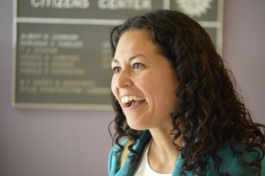 In this May 24, 2018 photo Xochitl Torres Small, a Democratic candidate for Congress, speaks to voters at a Las Cruces, N.M., event. With no mention of President Donald Trump, candidates for an open congressional seat along the U.S. border in New Mexico are blaming Washington politics for the separation of immigrant children from parents caught trying to come to the U.S. illegally. (AP Photo/ Russell Contreras)