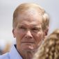 U.S. Sen. Bill Nelson looks toward the Homestead Temporary Shelter for Unaccompanied Children during news conference on Tuesday, June 19, 2018, in Homestead, Fla. Nelson was denied access to the facility. (AP Photo/Brynn Anderson)