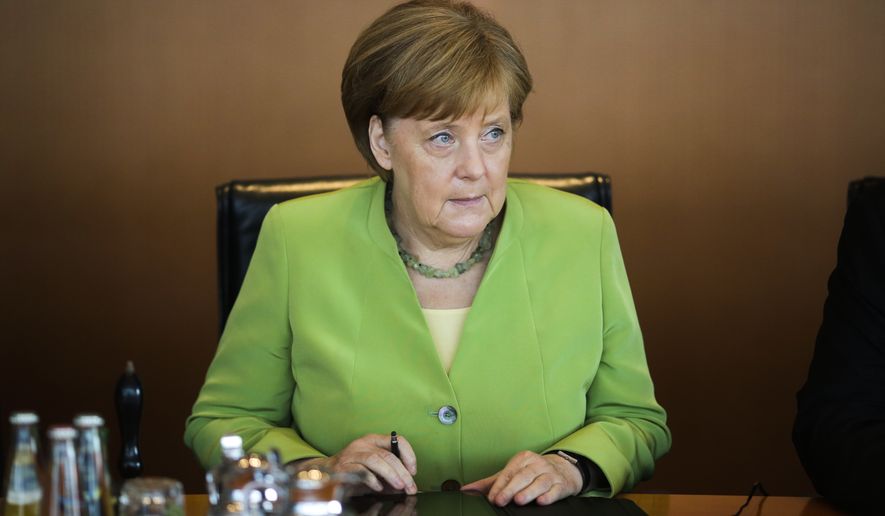 German Chancellor Angela Merkel attends the weekly cabinet meeting of the German government at the chancellery in Berlin, Wednesday, June 20, 2018. (AP Photo/Markus Schreiber)