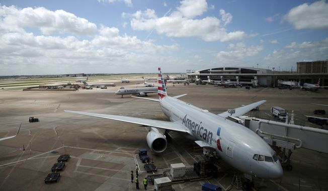 In this June 16, 2018, photo, American Airlines aircrafts are seen at Dallas-Fort Worth International Airport in Grapevine, Texas. American Airlines says it asked the Trump administration not to put migrant children who have been separated from their parents on its flights. In a statement Wednesday, June 20, American said it doesn&#x27;t know whether any migrant children have been on its flights and doesn&#x27;t want to profit from the current immigration policy of separating families. (AP Photo/Kiichiro Sato)