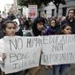 In this Feb. 28, 2018, file photo, demonstrators hold signs outside of the Immigration and Customs Enforcement offices in San Francisco. (AP Photo/Marcio Jose Sanchez, file)