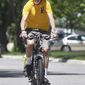 In a Wednesday, June 13, 2018 photo, Mankato bike advocate Richard Keir takes a spin around his neighborhood. The 82-year-old has been a key figure in making Mankto a more bike-friendly community. (Pat Christman/The Free Press via AP)