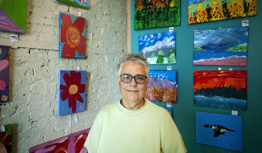 In this Tuesday, June 12, 2018 photo, Deborah Blackwell poses in her art studio, in Janesville, Wis. Blackwell is the executive director of Studio 84 in Whitewater, Wis. (Angela Major/The Janesville Gazette via AP)