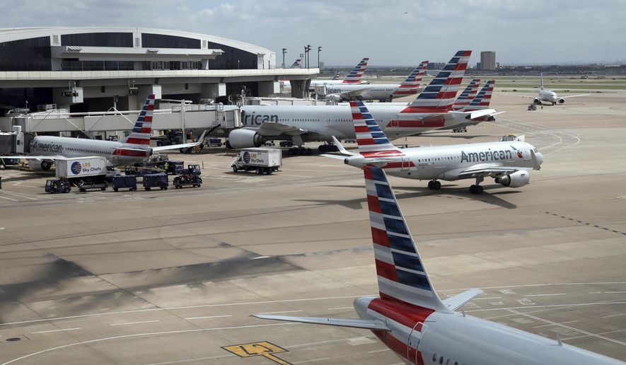 In this June 16, 2018 photo, American Airlines aircrafts are seen at Dallas-Fort Worth International Airport in Grapevine, Texas. American Airlines says it asked the Trump administration not to put migrant children who have been separated from their parents on its flights. In a statement Wednesday, June 20, American said it doesn&#39;t know whether any migrant children have been on its flights and doesn&#39;t want to profit from the current immigration policy of separating families. (AP Photo/Kiichiro Sato)
