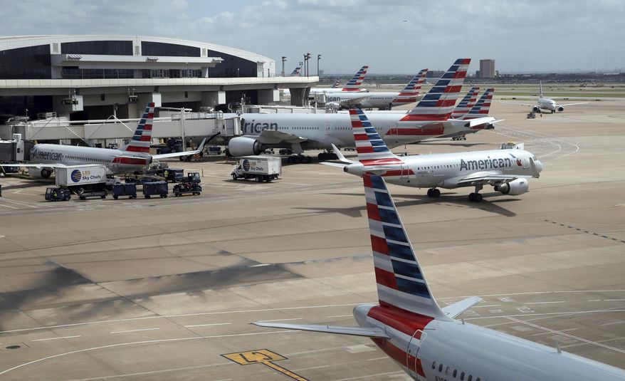In this June 16, 2018 photo, American Airlines aircrafts are seen at Dallas-Fort Worth International Airport in Grapevine, Texas. American Airlines says it asked the Trump administration not to put migrant children who have been separated from their parents on its flights. In a statement Wednesday, June 20, American said it doesn&#x27;t know whether any migrant children have been on its flights and doesn&#x27;t want to profit from the current immigration policy of separating families. (AP Photo/Kiichiro Sato)