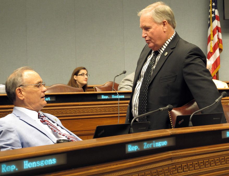 State Reps. Tony Bacala, R-Prairieville, left, and Rick Edmonds, R-Baton Rouge, speak ahead of a House Appropriations Committee meeting on budget cuts, Wednesday, June 20, 2018, in Baton Rouge, La. (AP Photo/Melinda Deslatte)