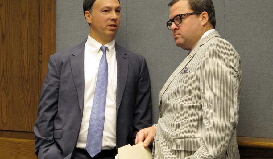 House Ways and Means Chairman Neil Abramson, D-New Orleans, left, speaks with state Rep. Stuart Bishop, R-Lafayette, ahead of the committee's vote to pass several tax bills to the full House for consideration, Wednesday, June 20, 2018, in Baton Rouge, La. Bishop sponsored one of the tax bills that passed. (AP Photo/Melinda Deslatte)