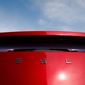  In this April 15, 2018, file photo, the sun shines off the rear deck of a roadster on a Tesla dealer&#39;s lot in the south Denver suburb of Littleton, Colo. (AP Photo/David Zalubowski, File)