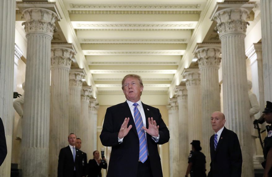 President Donald Trump speaks in the Hall of Columns as he arrives on Capitol Hill in Washington, Tuesday, June 19, 2018, to rally Republicans around a GOP immigration bill. However Republicans on Capitol Hill, mindful of the country's spreading outrage over separating families at the border, have been frantically searching for ways to end the Trump administration's policy. (AP Photo/Alex Brandon)