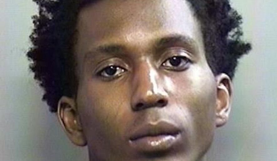 This photo provided by the the Arlington Police Department in Arlington, Texas, shows Joel Engobo Mambe. Mambe was arrested as a suspect after a University of Texas at Arlington student reported being abducted, robbed and sexually assaulted by an armed man. Arlington police say 20-year-old Joel Engobo Mambe was arrested Thursday, June 21, 2018, in Fort Worth. An Arlington police statement says some of the victim's property was recovered, along with a gun allegedly used in the attack. (Arlington Police Department via AP)