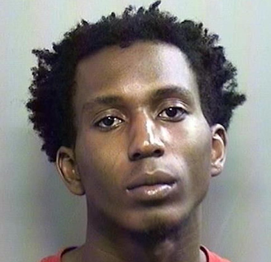 This photo provided by the the Arlington Police Department in Arlington, Texas, shows Joel Engobo Mambe. Mambe was arrested as a suspect after a University of Texas at Arlington student reported being abducted, robbed and sexually assaulted by an armed man. Arlington police say 20-year-old Joel Engobo Mambe was arrested Thursday, June 21, 2018, in Fort Worth. An Arlington police statement says some of the victim's property was recovered, along with a gun allegedly used in the attack. (Arlington Police Department via AP)